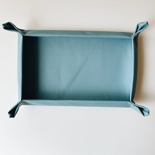Teal leather tray with 'HOYO' branding on a white background