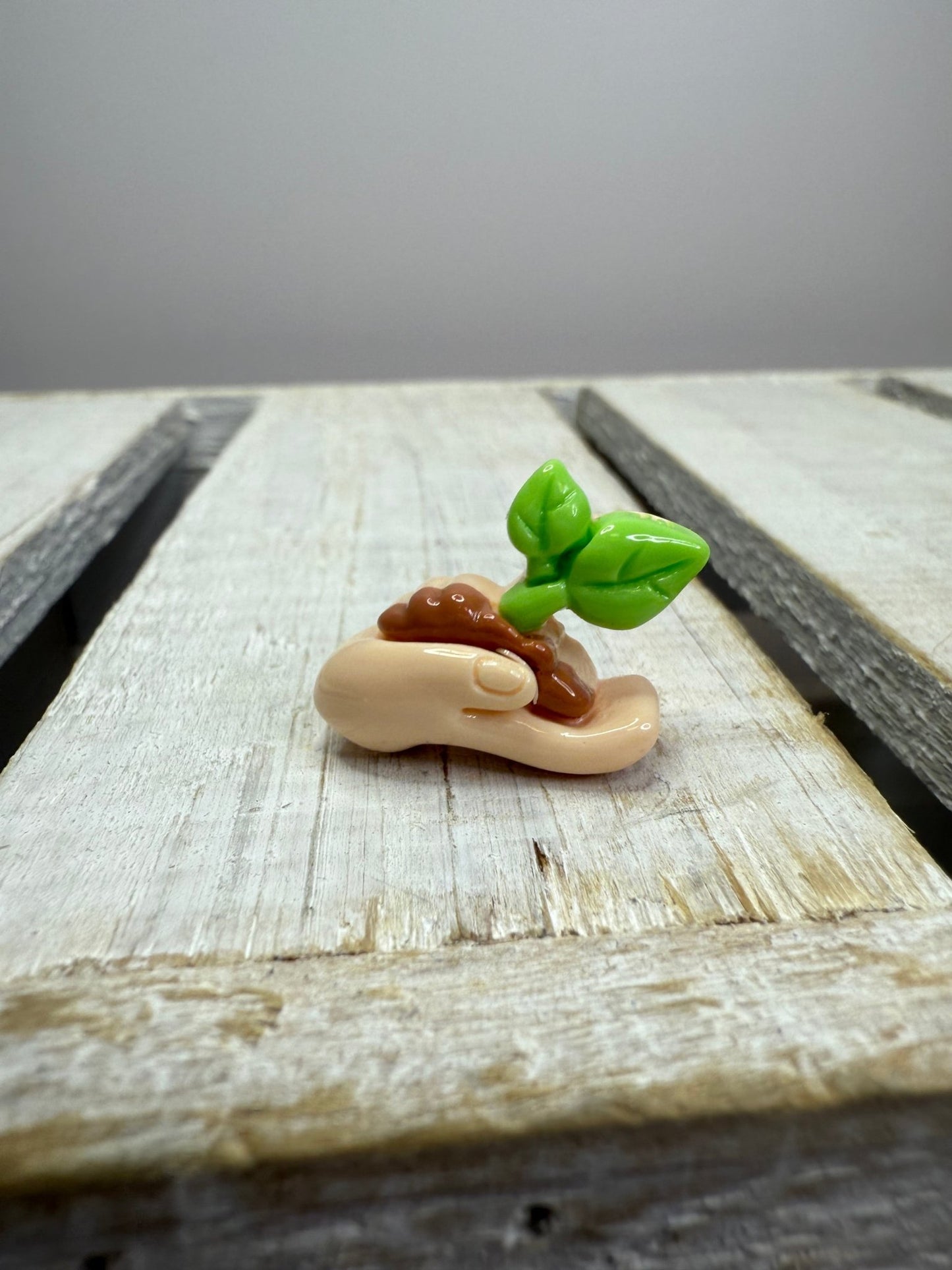Miniature Hand holding Sprout Earth Day Mini Object for Speech Therapy Garden Minis - Speech and Smile